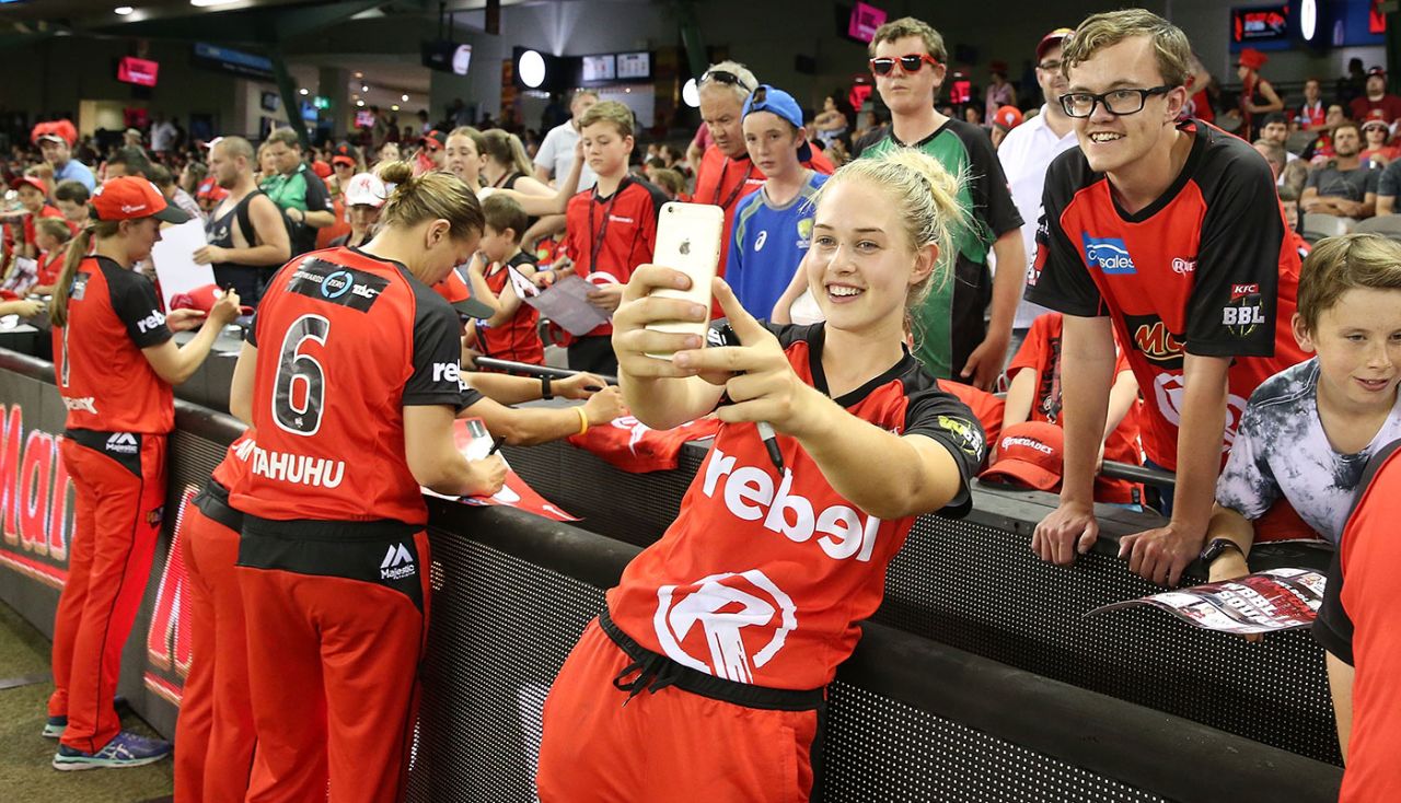 Maitlan Brown takes a photograph with a fan, Renegades v Stars, January 7, 2017