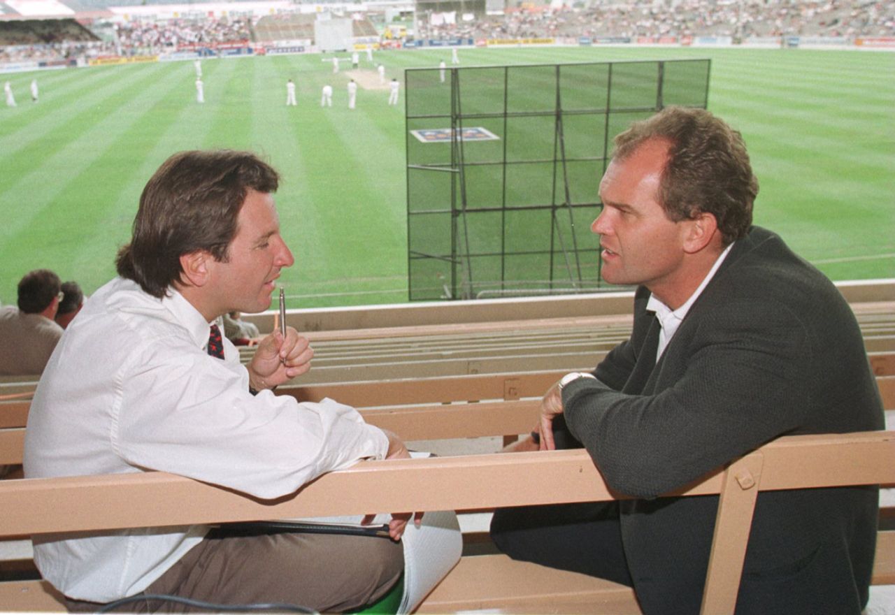 Mark Nicholas (left) talks to Martin Crowe in the stands, New Zealand v England, third Test, day three, Christchurch, February 16, 1997