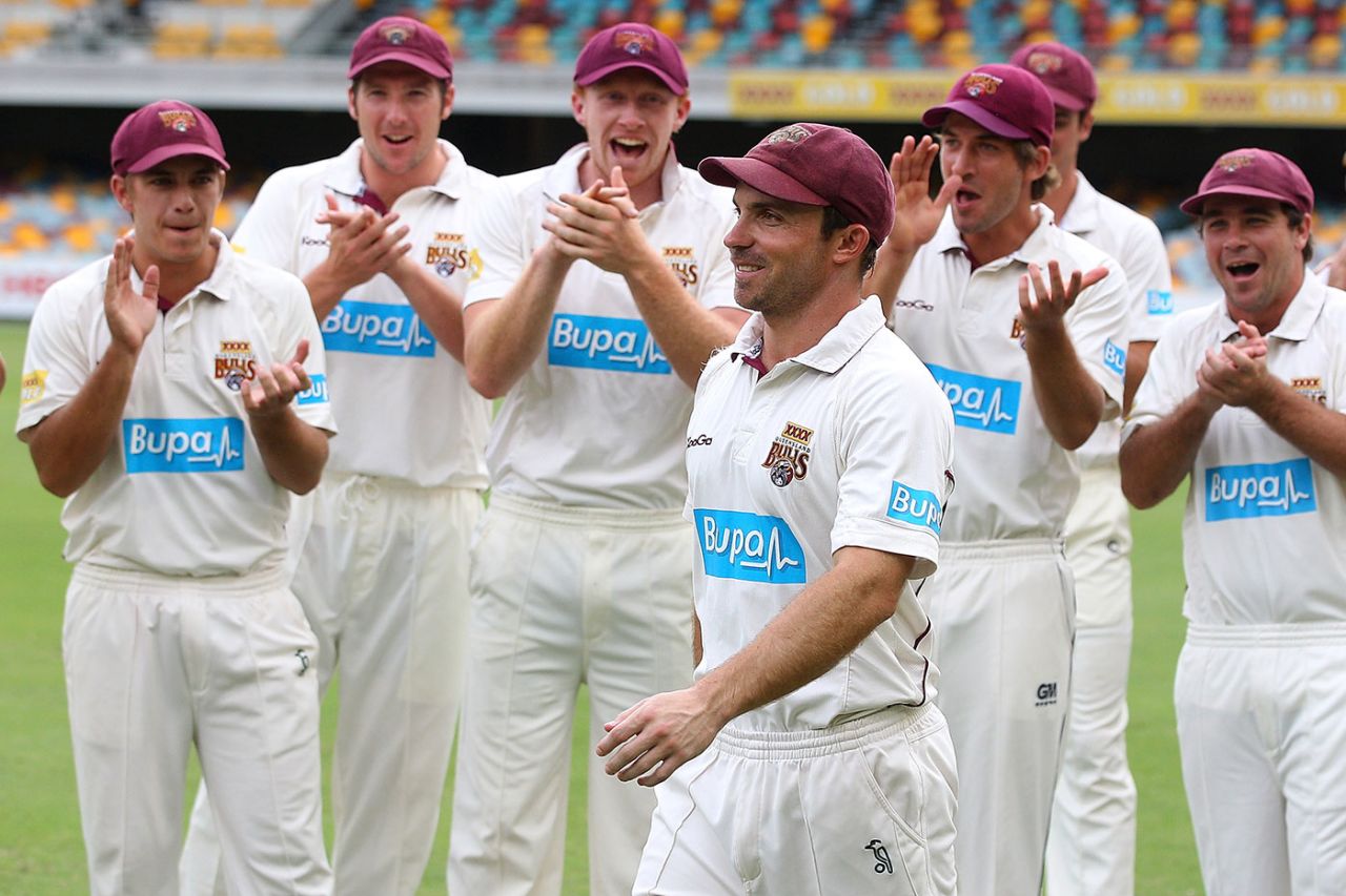 Queensland players cheer as Chris Hartley is awarded the Man-of-the-Match award, Queensland v Tasmania, Sheffield Shield, 4th day, Brisbane, March 19, 2012