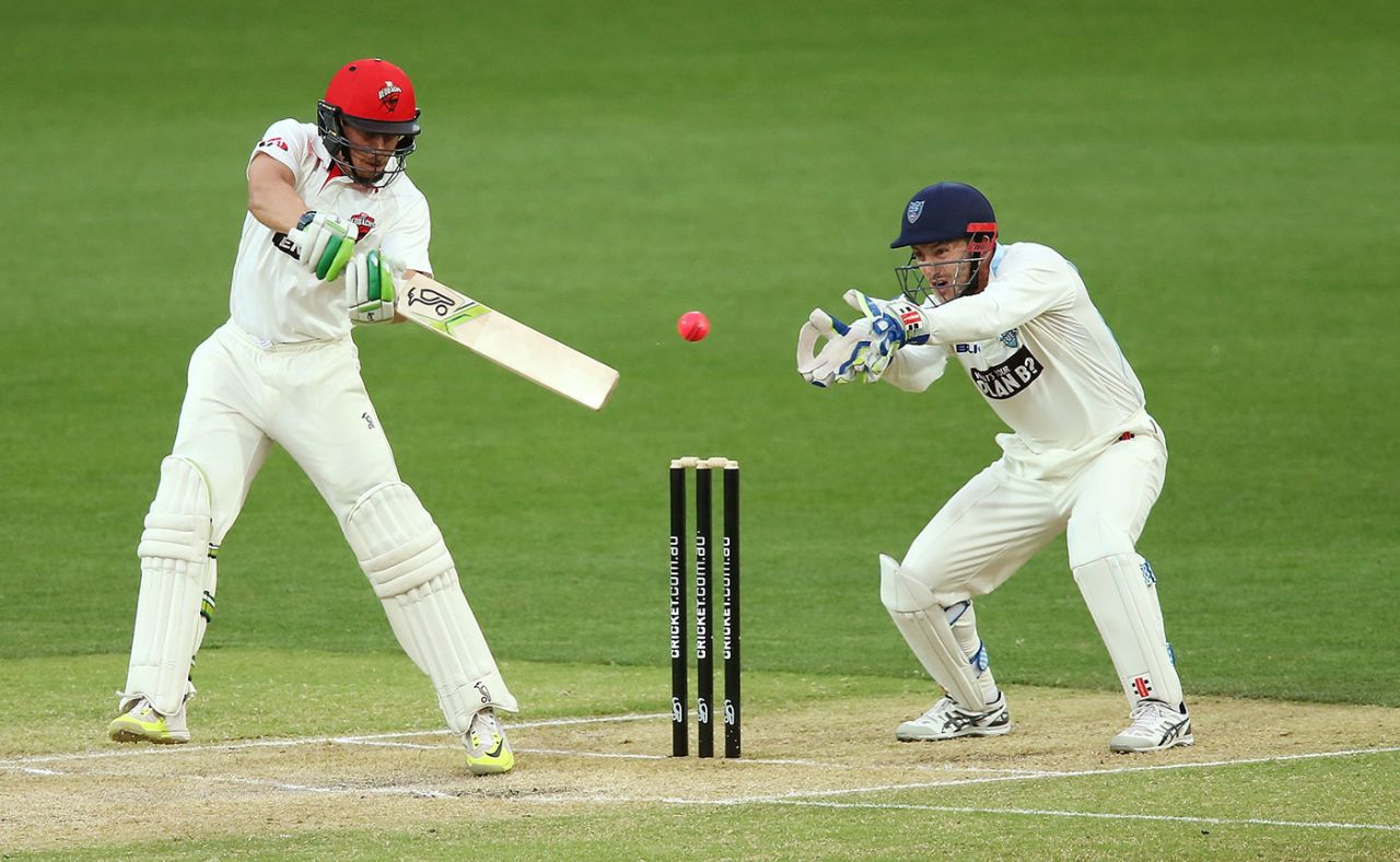 Alex Carey cuts the ball watched by wicketkeeper Peter Nevill, South Australia v Queensland, Sheffield Shield, Adelaide, 3rd day, December 7, 2016