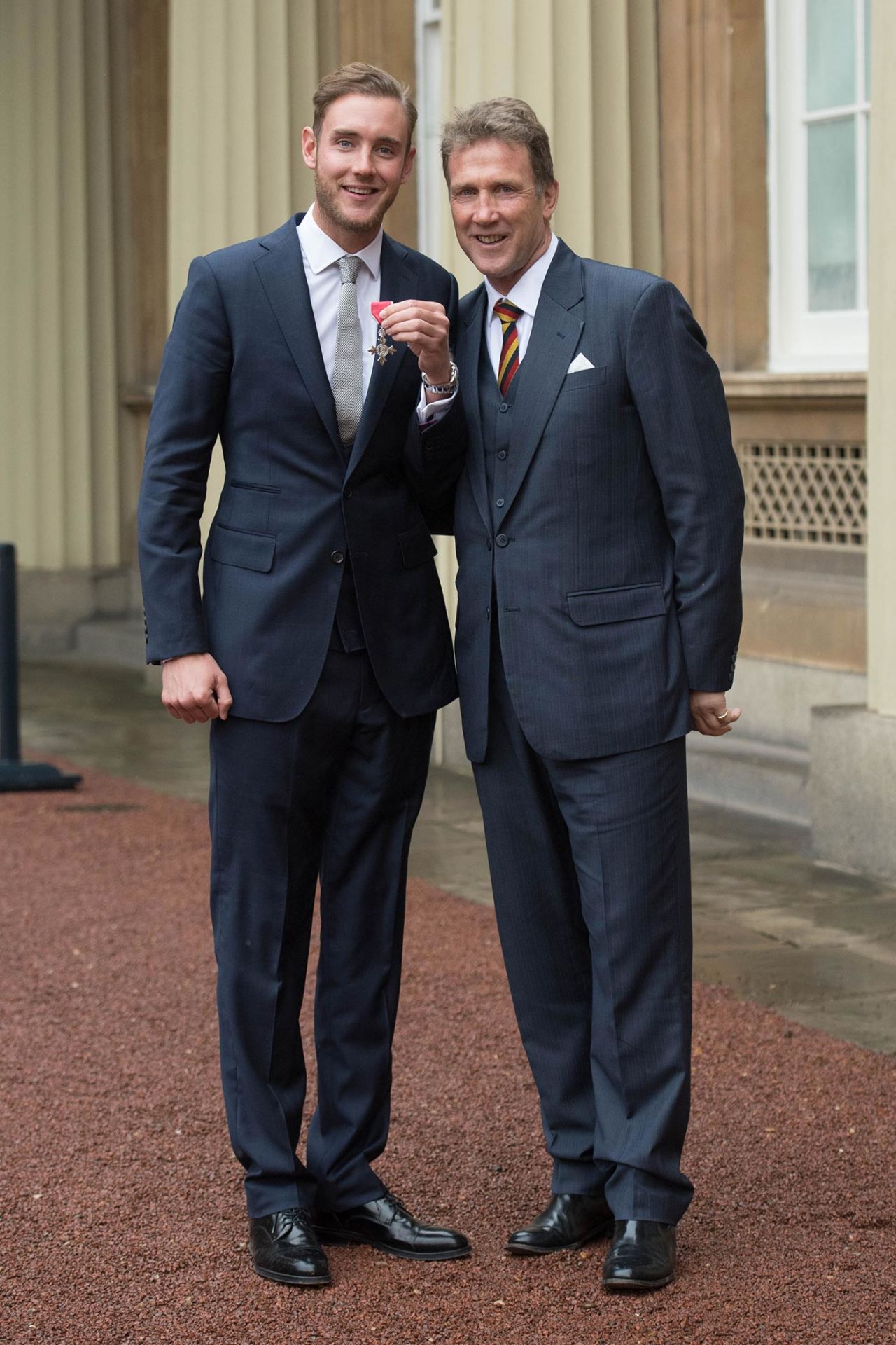 Stuart Broad poses with his MBE alongside his father Chris Broad, Buckingham Palace, February 10, 2017