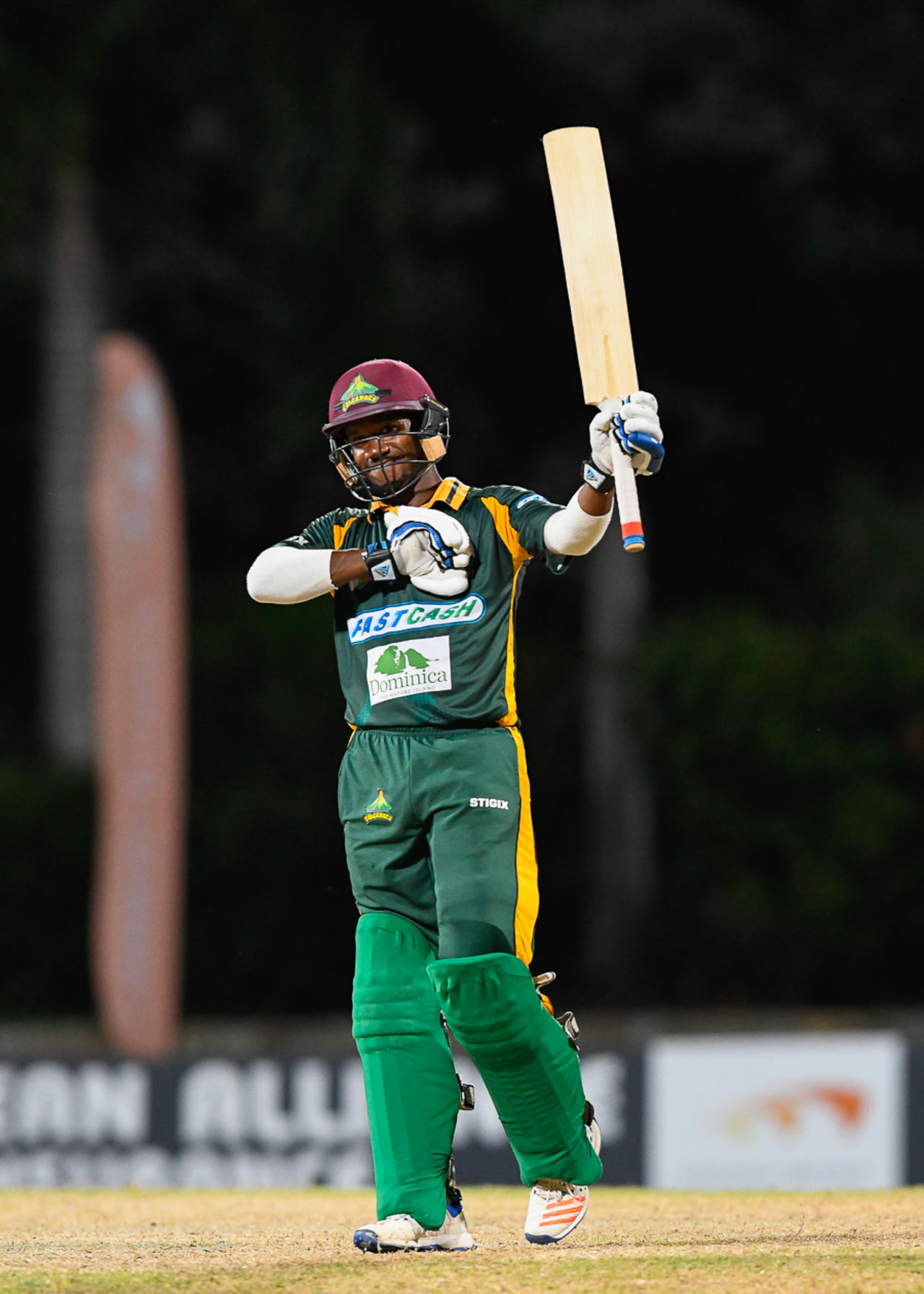 Kavem Hodge raises his bat after reaching his maiden List A fifty, Kent v Windward Islands, Regional Super50, Group A, Coolidge, February 10, 2017