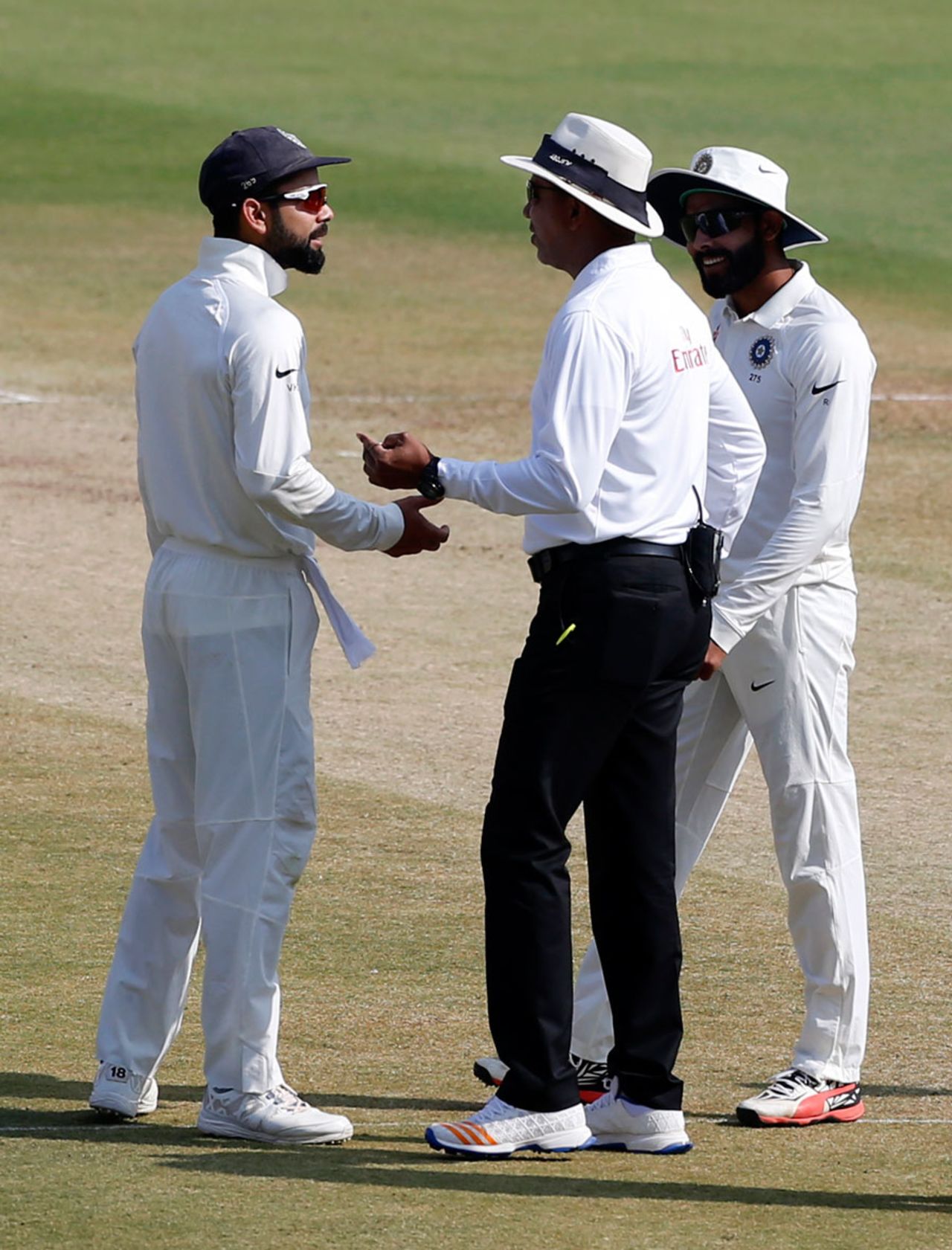 Virat Kohli and Ravindra Jadeja chat with umpire Joel Wilson, India v Bangladesh, one-off Test, Hyderabad, 5th day, February 13, 2017