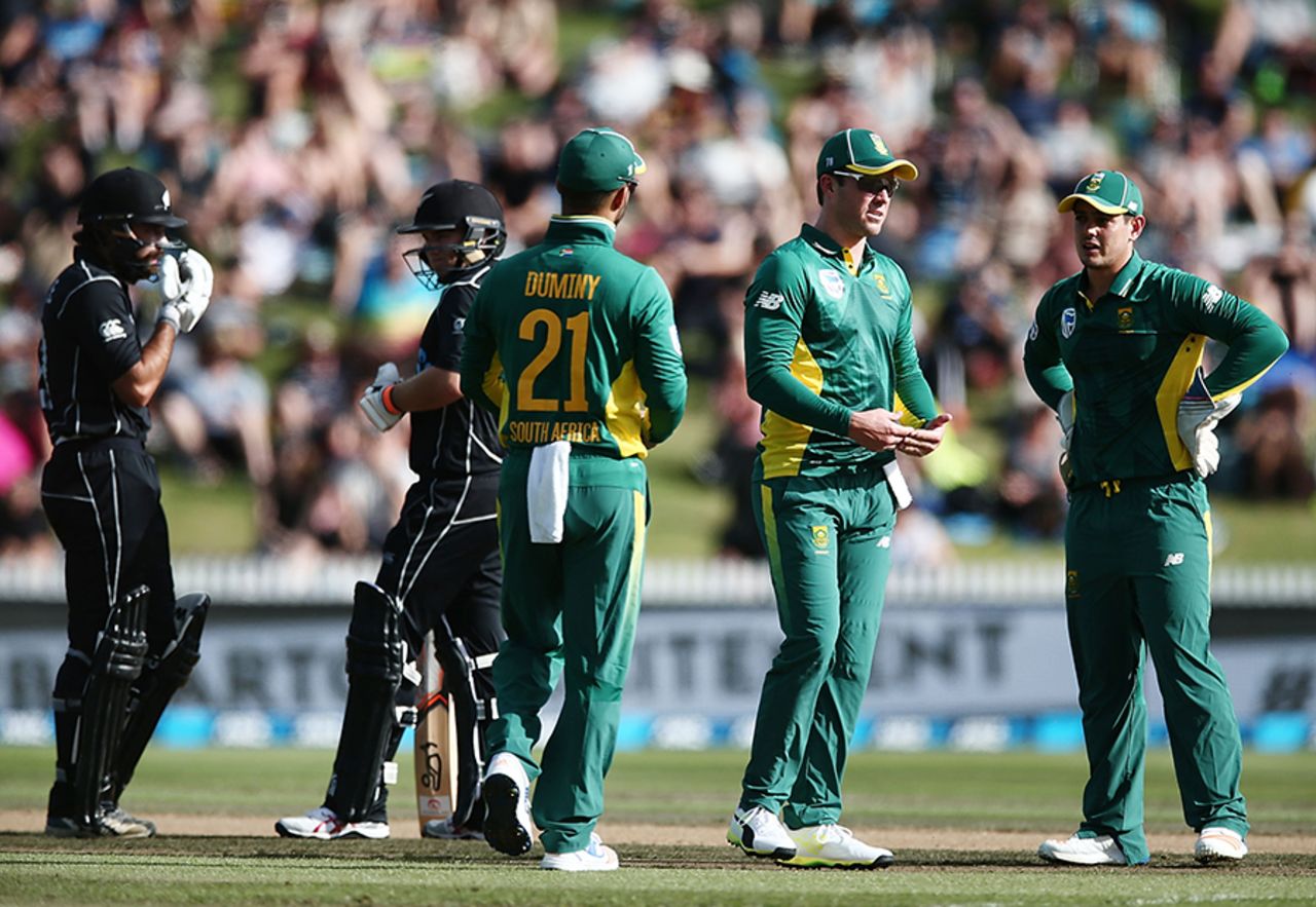 JP Duminy, AB de Villiers and Quinton de Kock wait on a review for Tom Latham's wicket, New Zealand v South Africa, 1st ODI, Hamilton, February 19, 2017