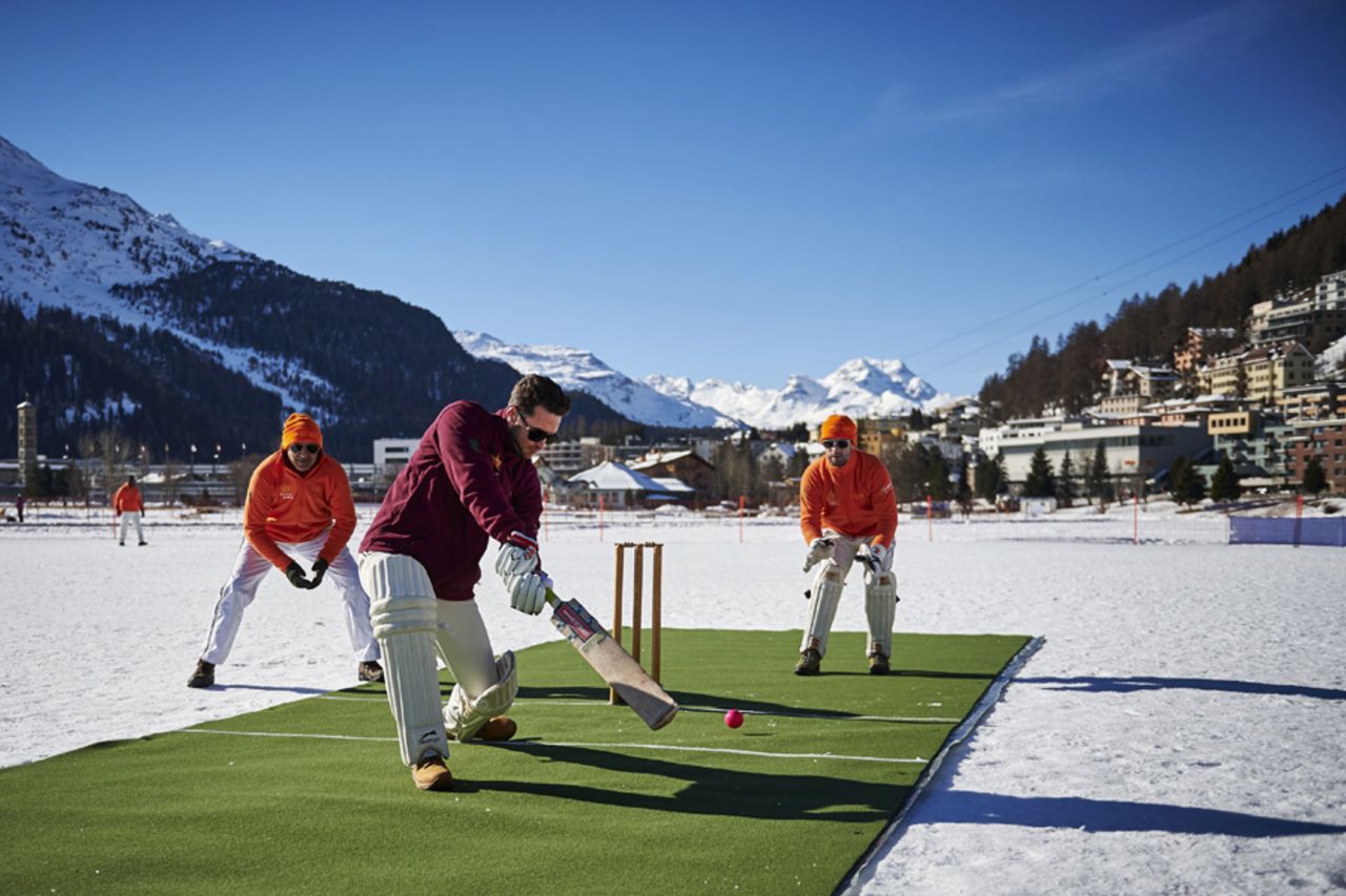 Players warm up before the 30th Cricket on Ice tournament held on the frozen surface of Lake St. Moritz, Switzerland, February 25, 2017