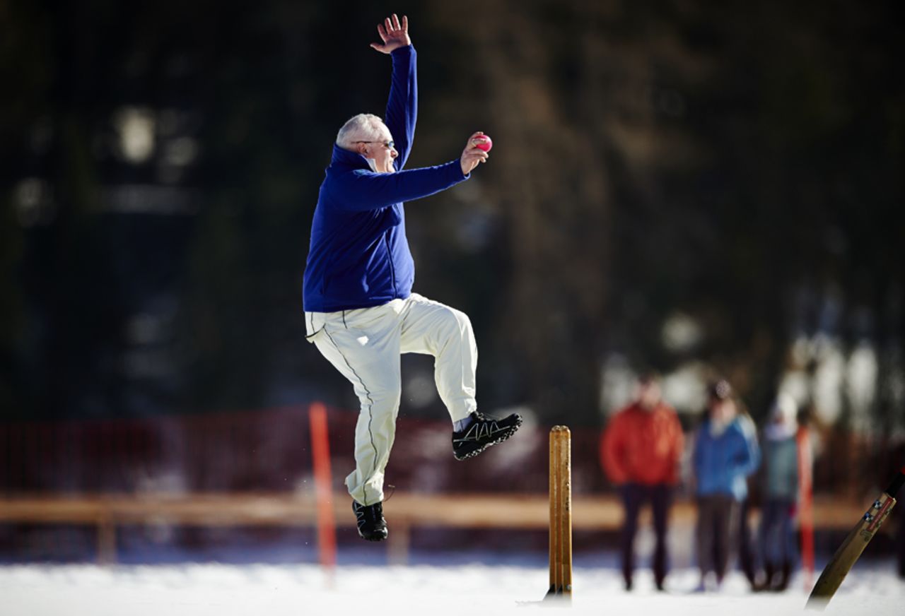 For the love of the game: A player bowls during the 30th Cricket on Ice tournament, Switzerland, February 25, 2017