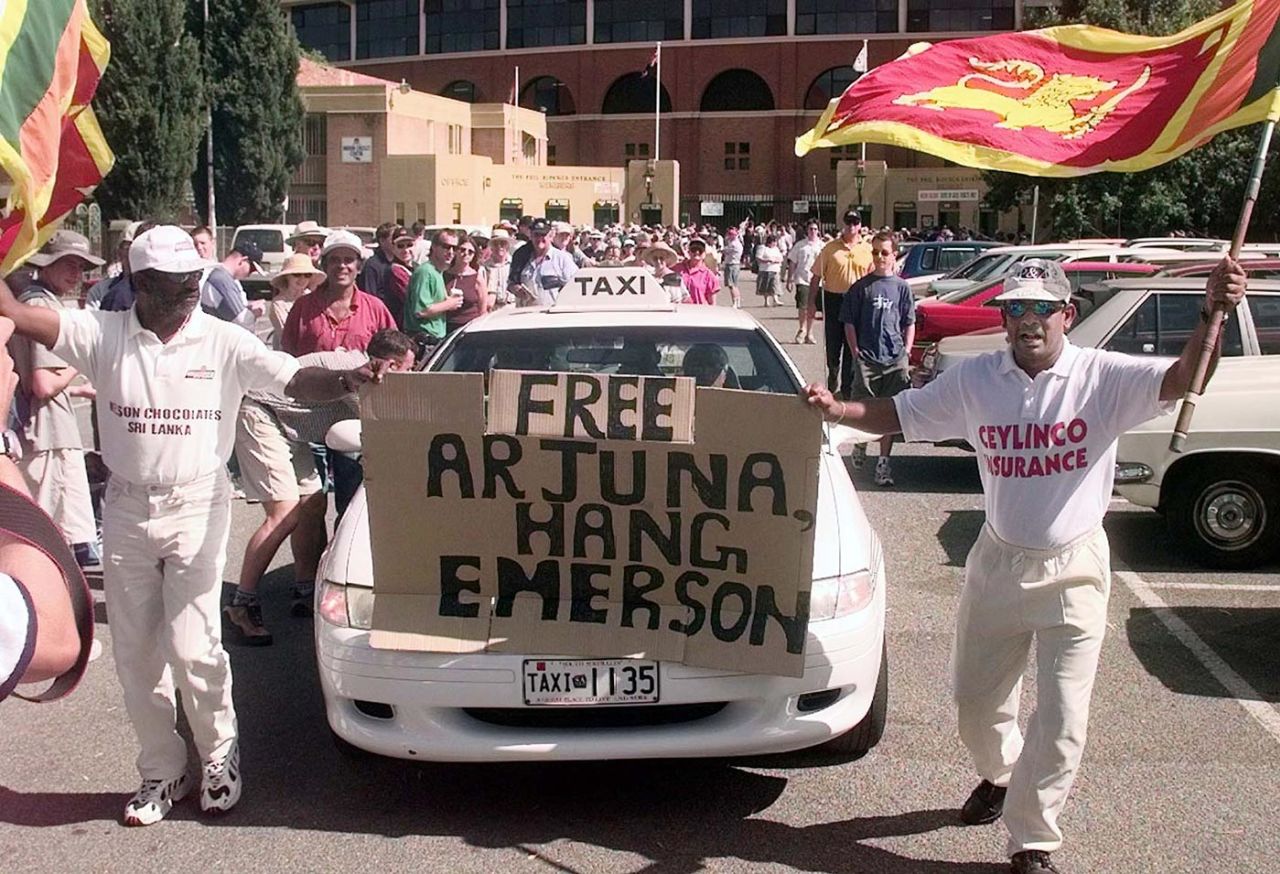 Sri Lankan fans hold up a banner in support of Arjuna Ranatunga as he leaves a disciplinary hearing at Adelaide Oval for breaching the code of conduct, January 26, 1999