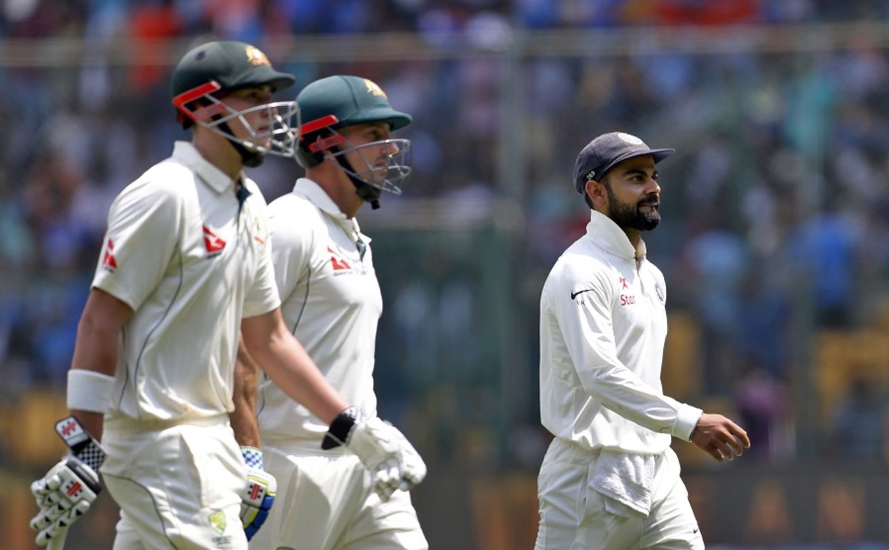 Matt Renshaw, Shaun Marsh and Virat Kohli walk off the field, India v Australia, 2nd Test, Bengaluru, 2nd day, March 5, 2017