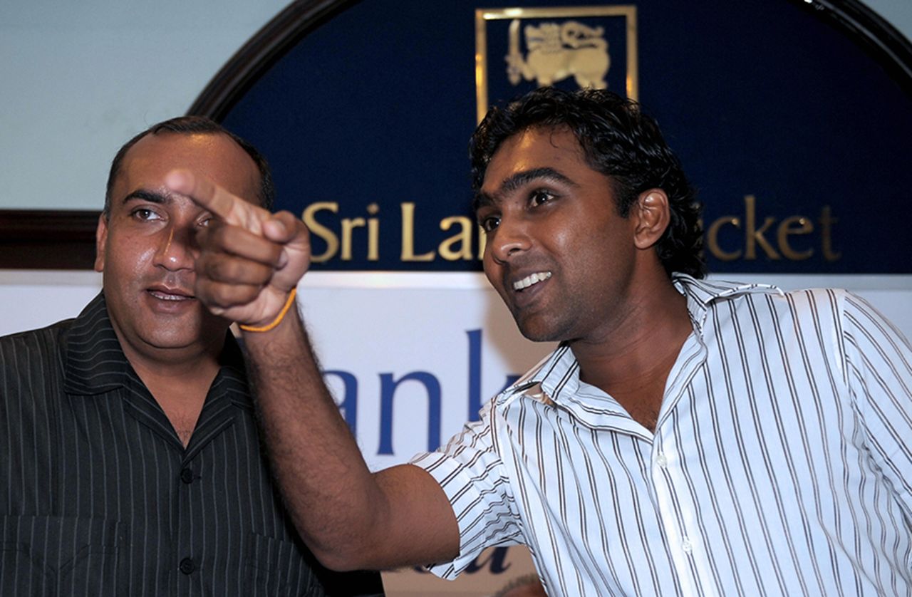 Meher Muhammad Khalil, the driver of Sri Lanka's team bus during the 2009 terror attack in Lahore, chats with Mahela Jayawardene during a felicitation ceremony, Colombo, April 6, 2009