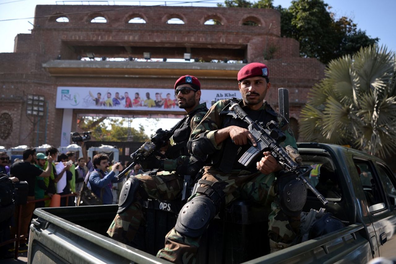 Pakistani soldiers stand guard as fans queue up outside the stadium, Peshawar Zalmi v Quetta Gladiators, PSL 2016-17, final, Lahore, March 5, 2017
