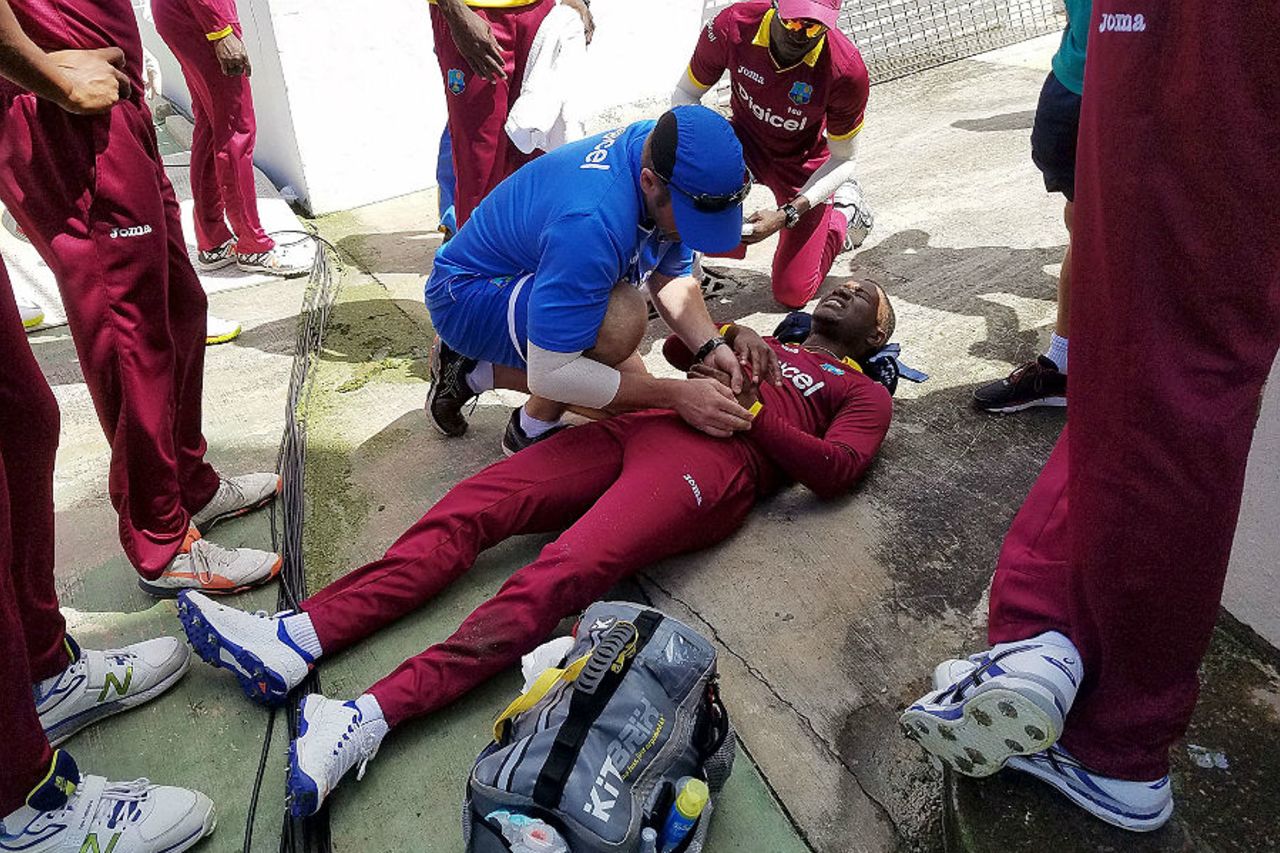 Evin Lewis required treatment after slipping over the boundary, West Indies v England, 3rd ODI, Barbados, March 9, 2017