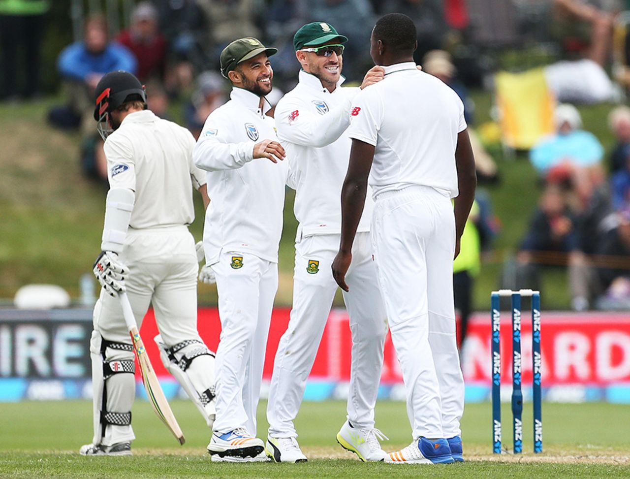 JP Duminy and Faf du Plessis celebrate Kane Williamson's wicket with Kagiso Rabada, New Zealand v South Africa, 1st Test, Dunedin, 3rd day, March 10, 2017