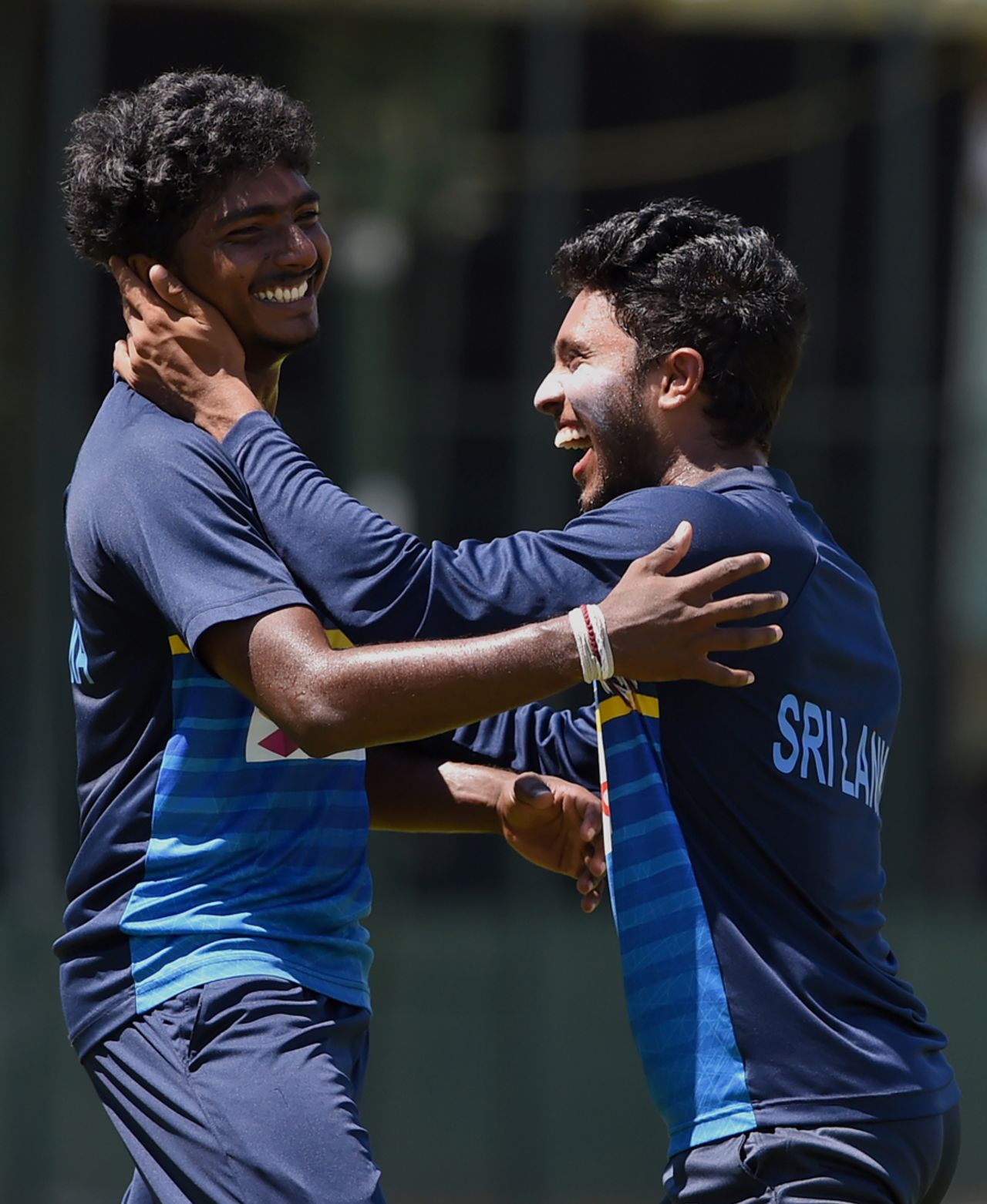Lakshan Sandakan shares a laugh with Kusal Mendis during a training session, Colombo, March 13, 2017