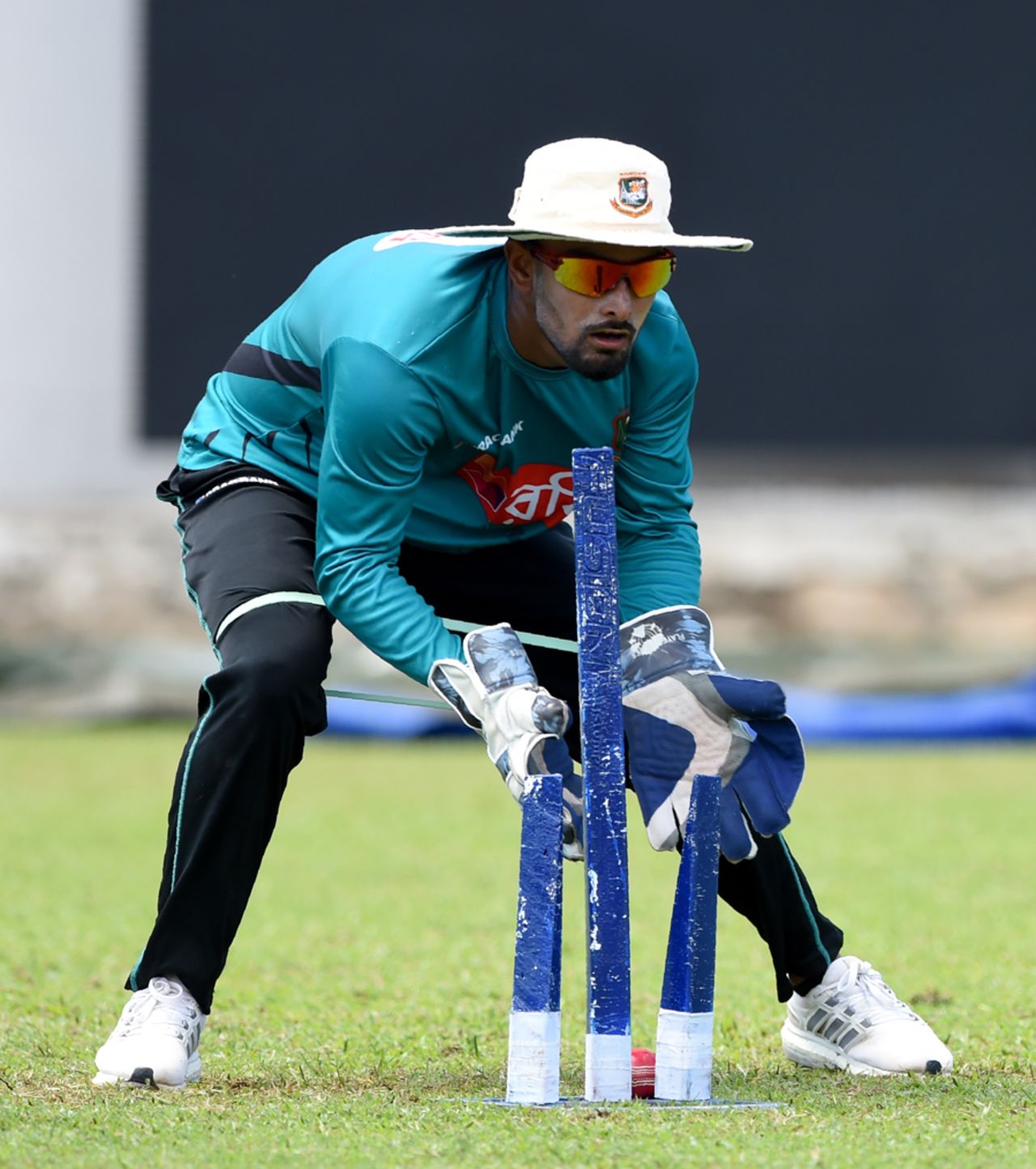Liton Das hones his glovework during training, Colombo, March 13, 2017