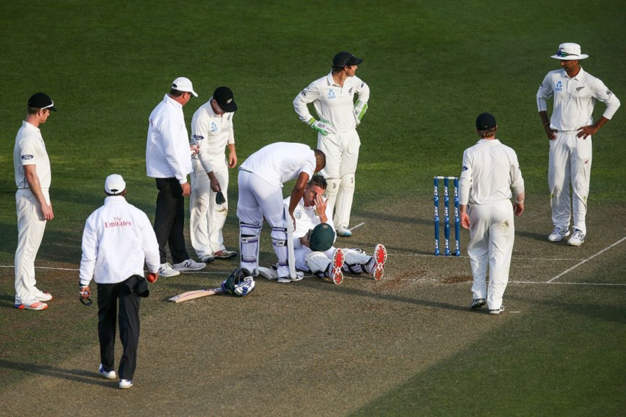 The New Zealand players check on Morne Morkel after a bouncer struck his helmet, New Zealand v South Africa, 2nd Test, Wellington, 2nd day, March 17, 2016