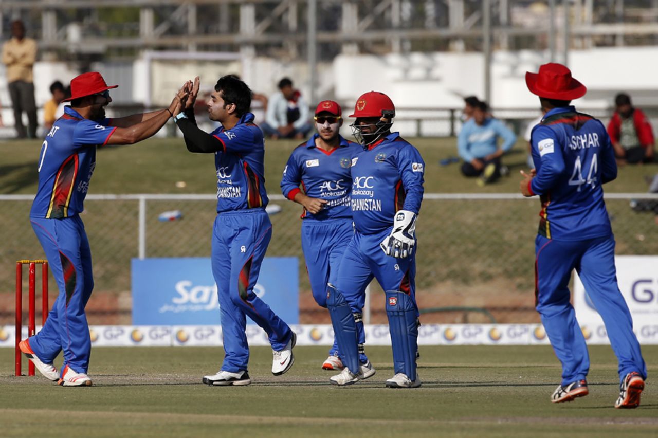 Rashid Khan celebrates a wicket with his team-mates, Afghanistan v Ireland, 2nd ODI, Greater Noida, March 17, 2017