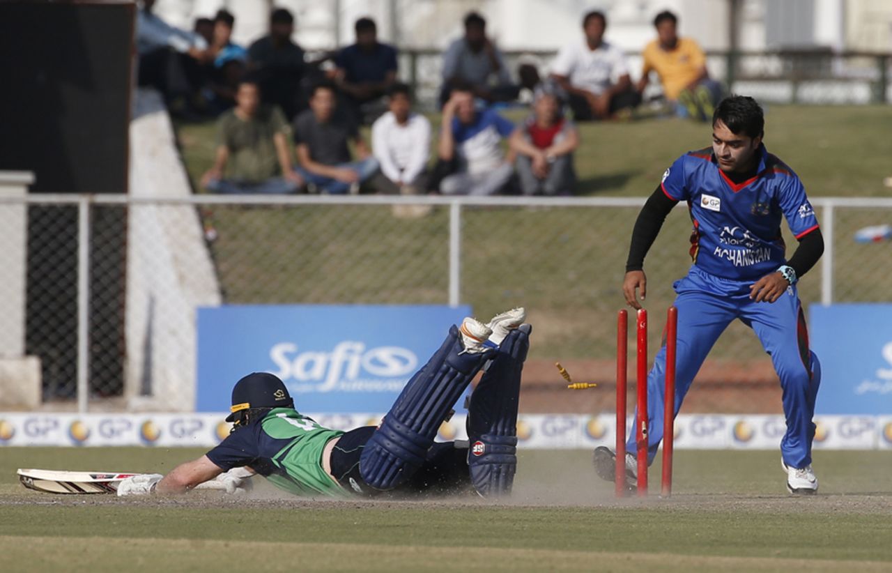 Gary Wilson dives to make his crease as Rashid Khan watches, Afghanistan v Ireland, 2nd ODI, Greater Noida, March 17, 2017