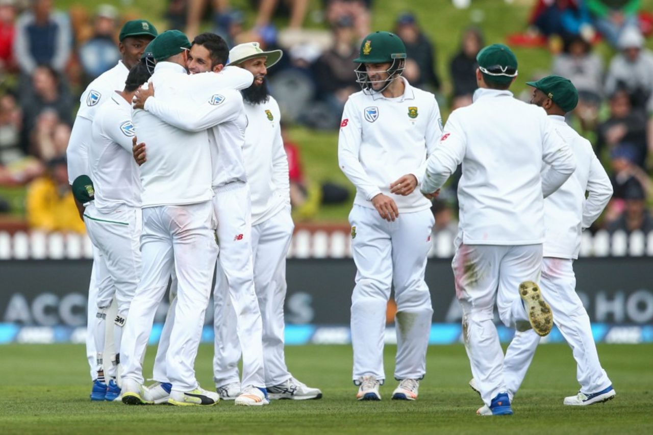 Keshav Maharaj gets a hug from his captain Faf du Plessis after a wicket, New Zealand v South Africa, 2nd Test, Wellington, 3rd day, March 18, 2017