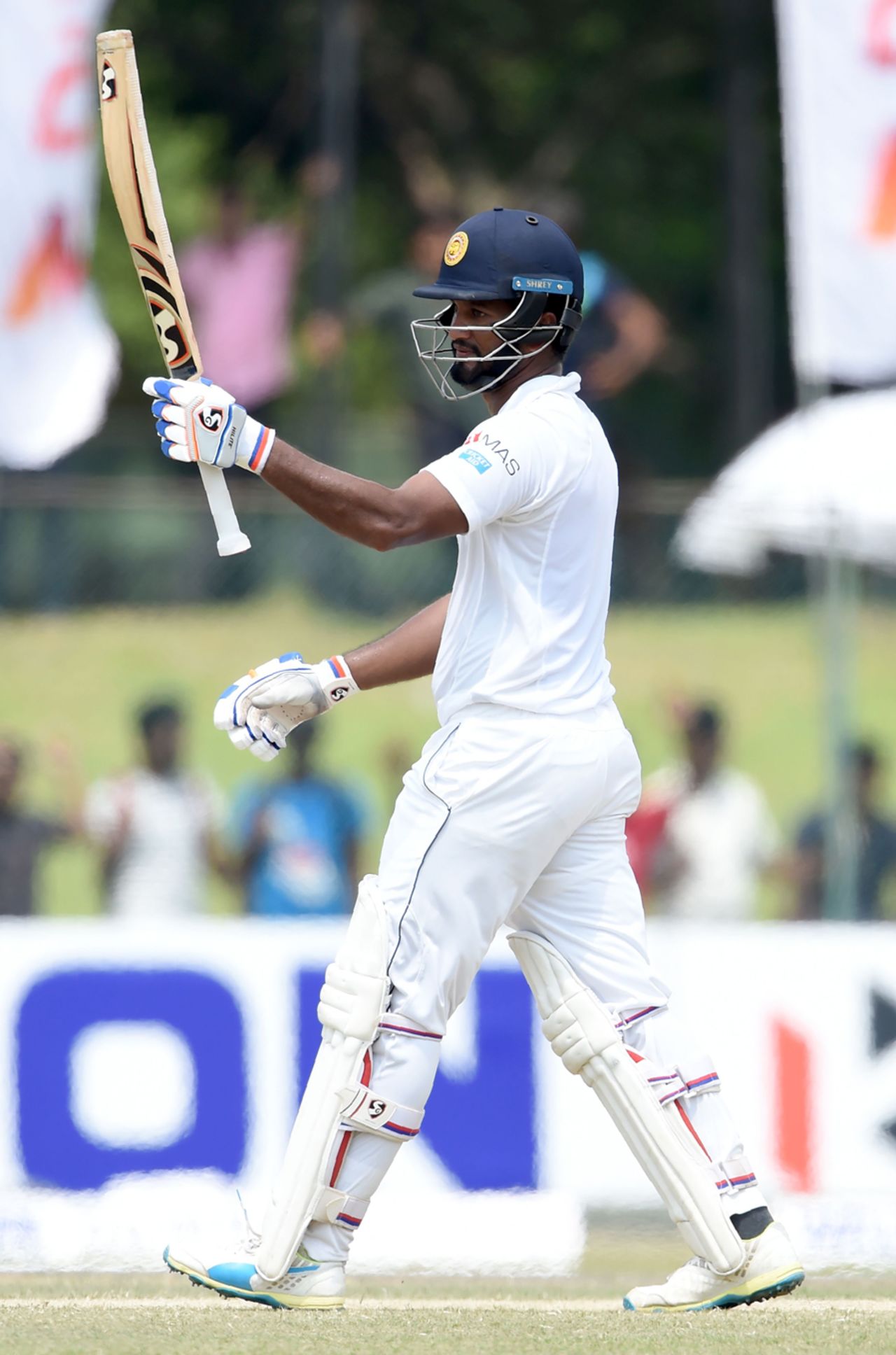 Dimuth Karunaratne raises his bat after scoring his fifth Test century, Sri Lanka v Bangladesh, 2nd Test, Colombo, 4th day, March 18, 2017