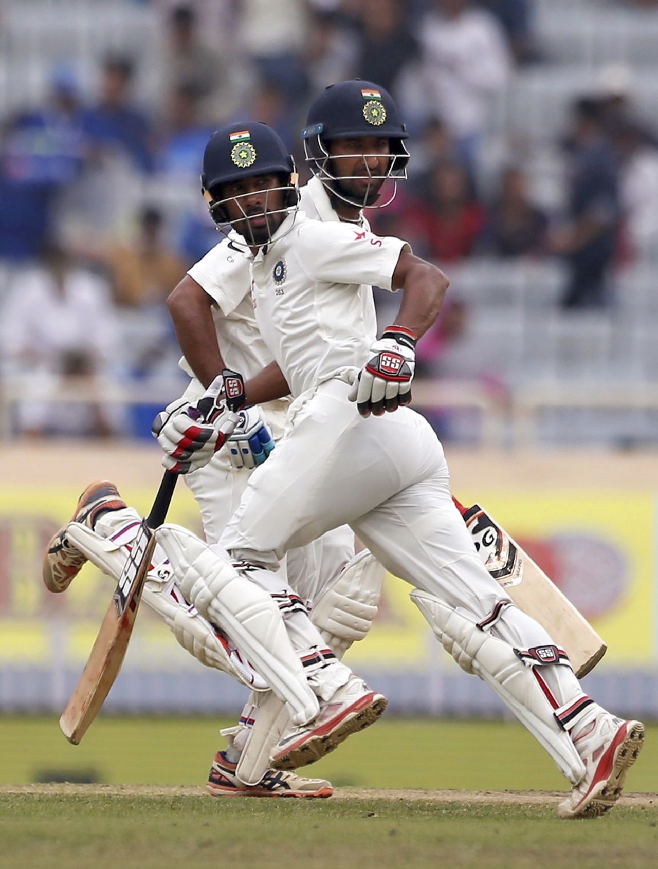 Wriddhiman Saha and Cheteshwar Pujara run between the wickets during their 199-run partnership, India v Australia, 3rd Test, Ranchi, 4th day, March 19, 2017