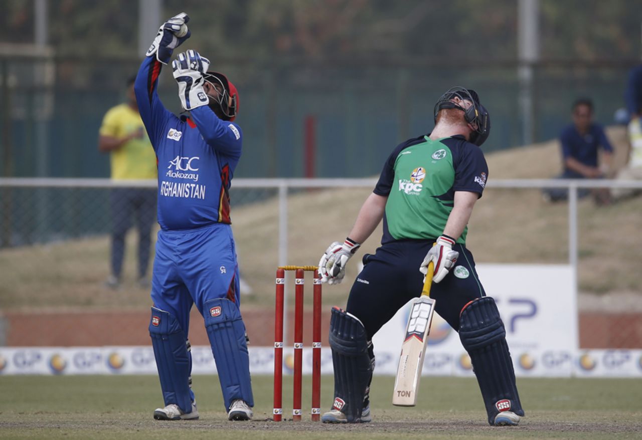 Paul Stirling and Mohammad Shahzad react similarly after a close chance, Afghanistan v Ireland, 3rd ODI, Greater Noida, March 19, 2017
