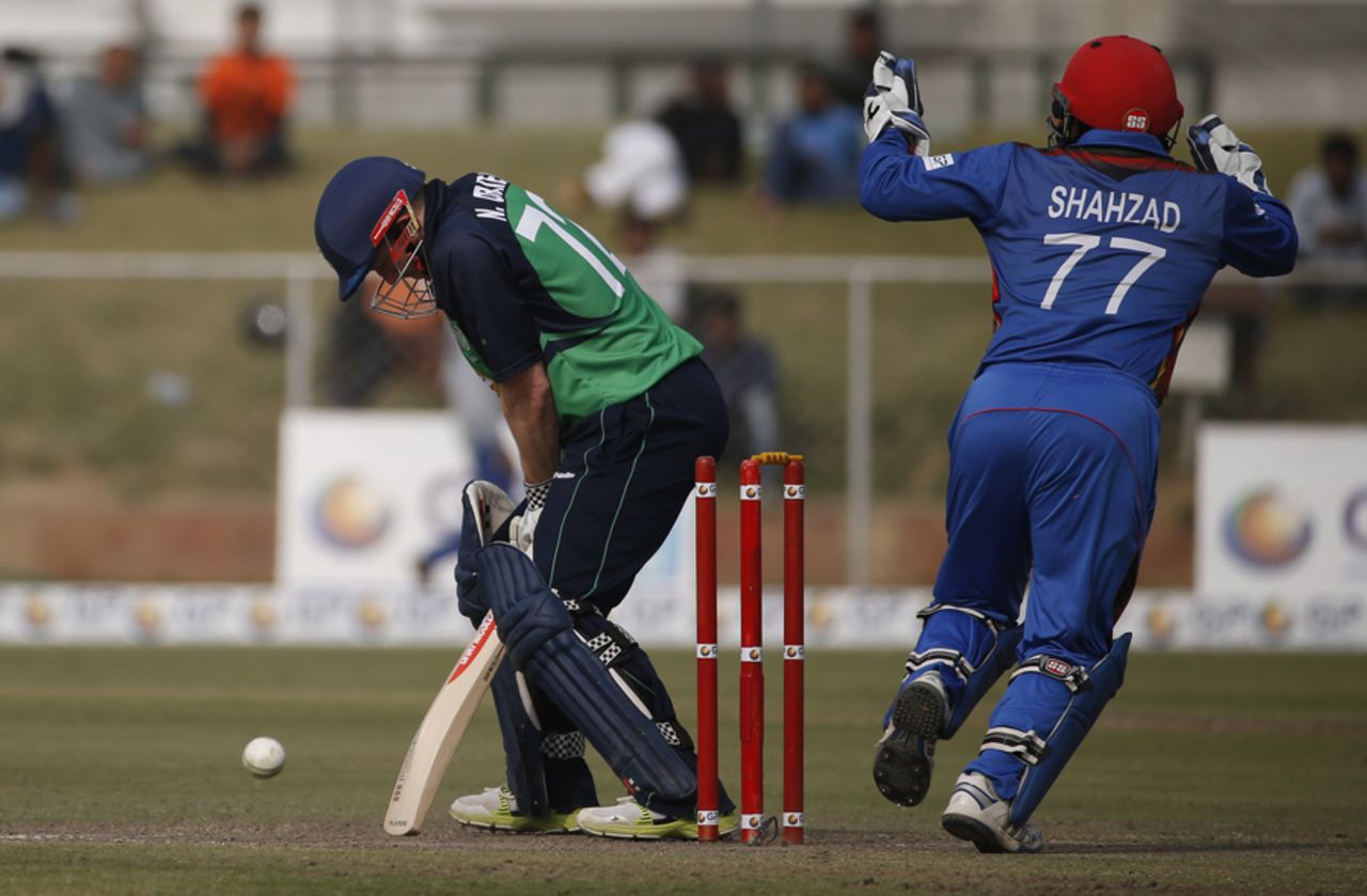 Mohammad Shahzad celebrates after Niall O'Brien loses his off stump, Afghanistan v Ireland, 3rd ODI, Greater Noida, March 19, 2017