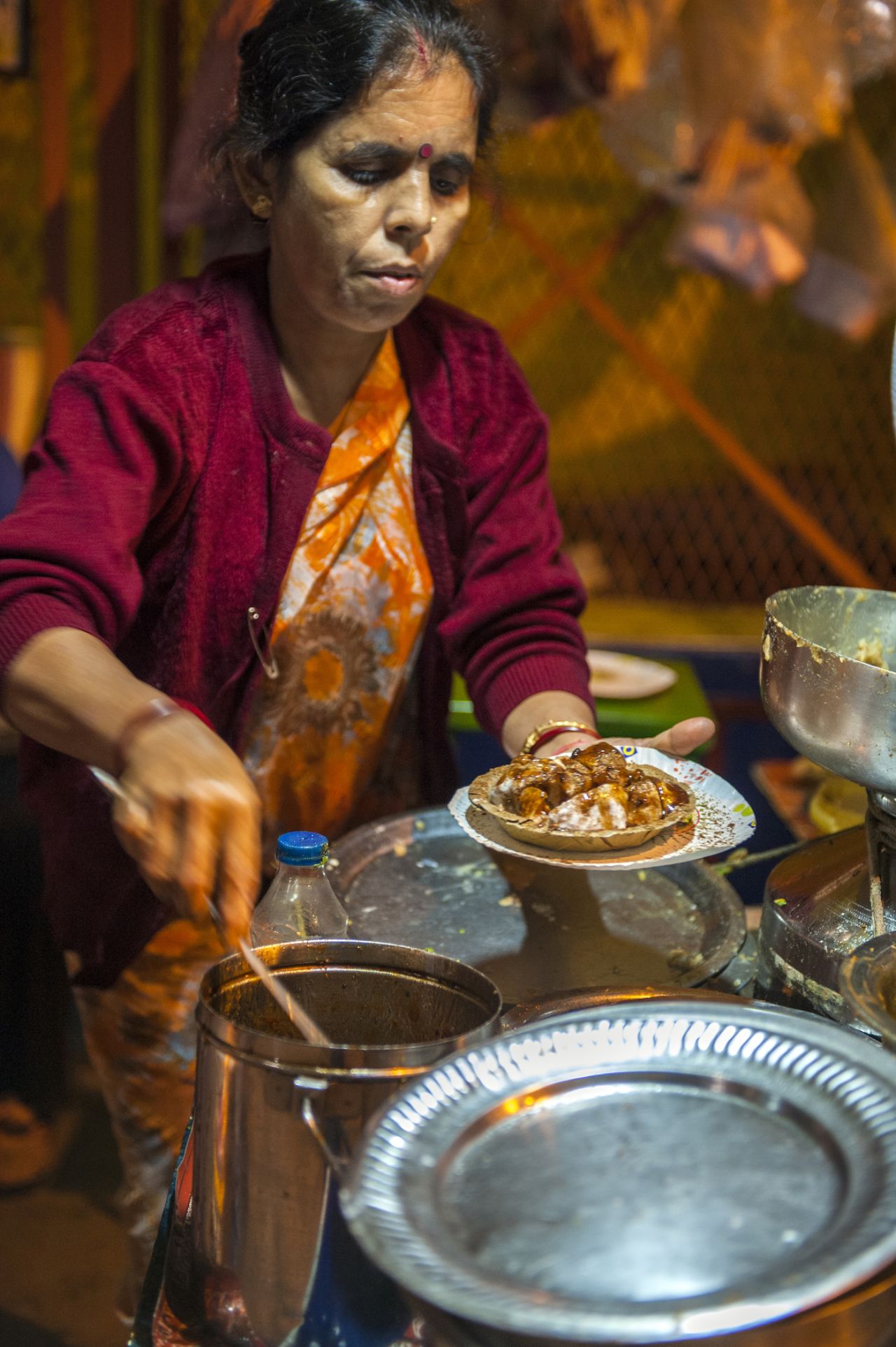Puchkas, savoury bombs of semolina pastry filled with mashed potato, chickpeas, tamarind paste and chaat masala, are a favourite street snack