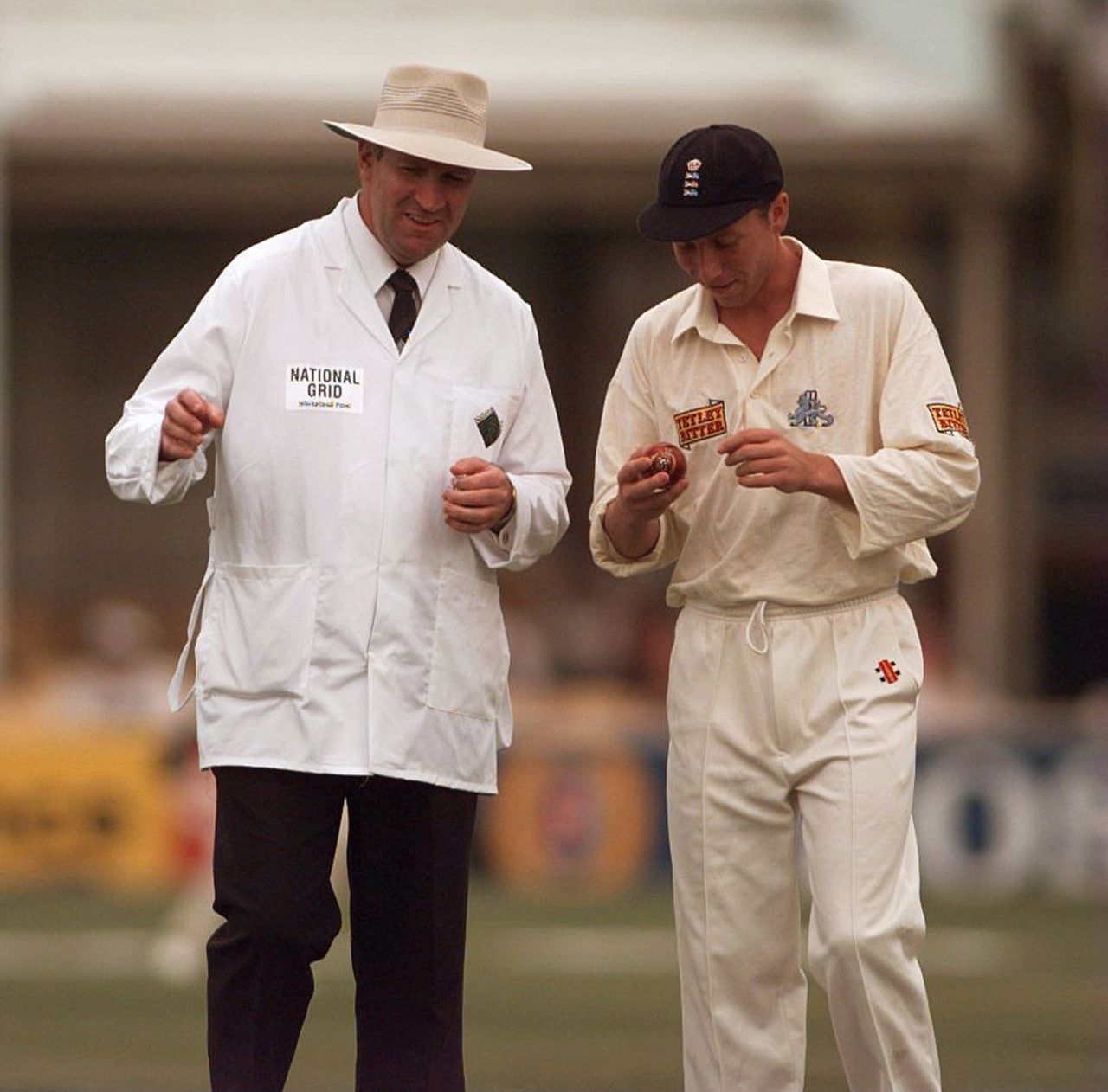 Michael Atherton attends to the ball in Darrell Hair's presence, England v India, 1st Test, Edgbaston, 2nd day, June 7, 1996
