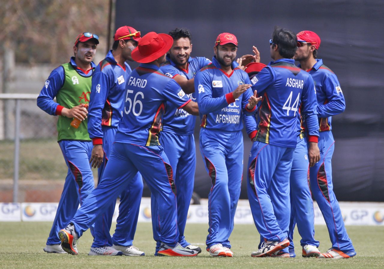 The Afghanistan players celebrate a wicket, Afghanistan v Ireland, 5th ODI, Greater Noida, March 24, 2017