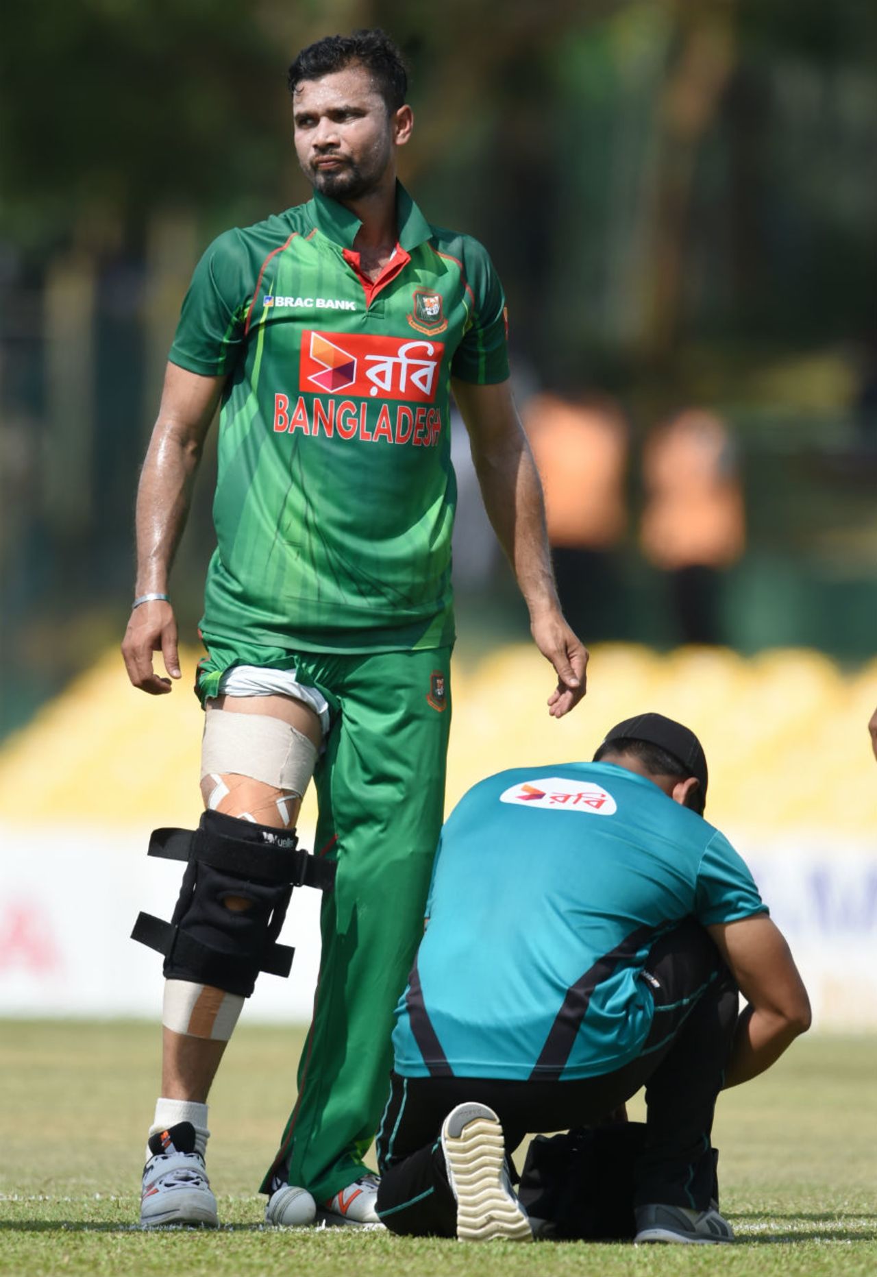 Mashrafe Mortaza gets attention from the physio after damaging his knee brace, Sri Lanka v Bangladesh, 2nd ODI, Dambulla, March 28, 2017