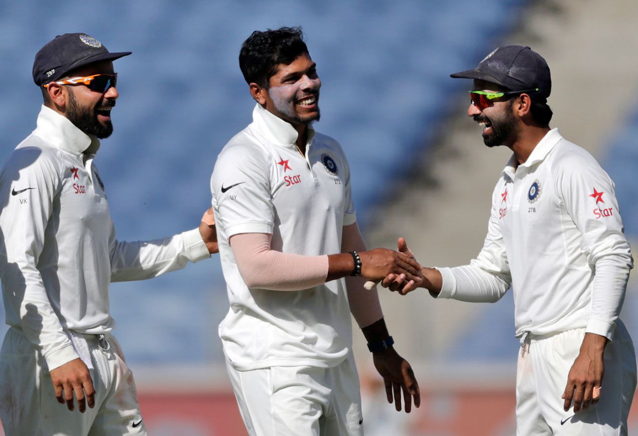 Umesh Yadav is congratulated by Ajinkya Rahane and Virat Kohli , India v Australia, 1st Test, Pune, 1st day, February 23, 2017