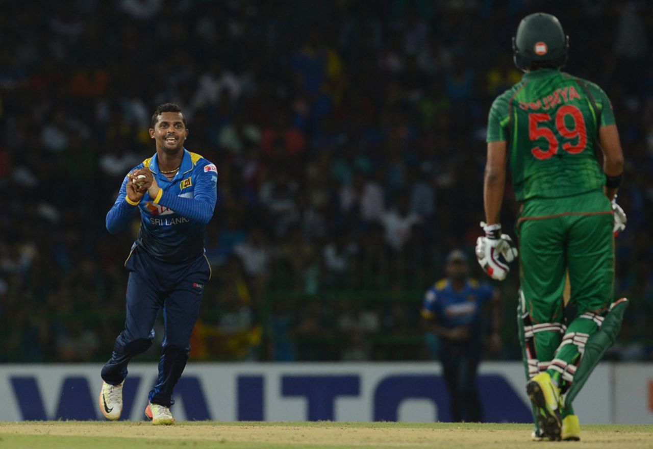 Asela Gunaratne holds on to a catch off his own bowling to remove Soumya Sarkar, Sri Lanka v Bangladesh, 2nd T20I, Colombo, April 6, 2017