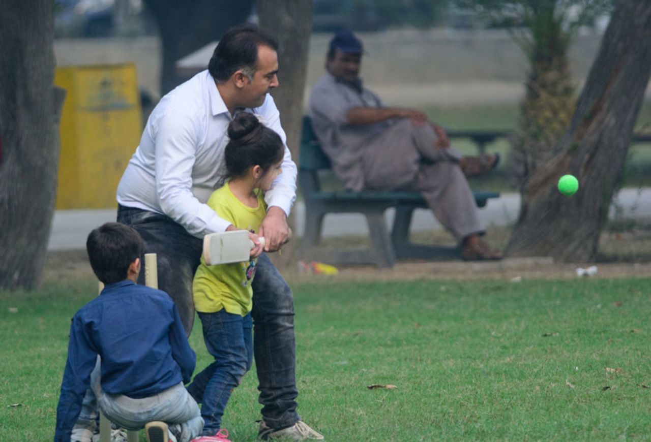 <b>Moazam Rauf:</b> A Dad trying to teach his daughter a bit about batting at Gillani Park a.k.a. Race Course Park, Lahore