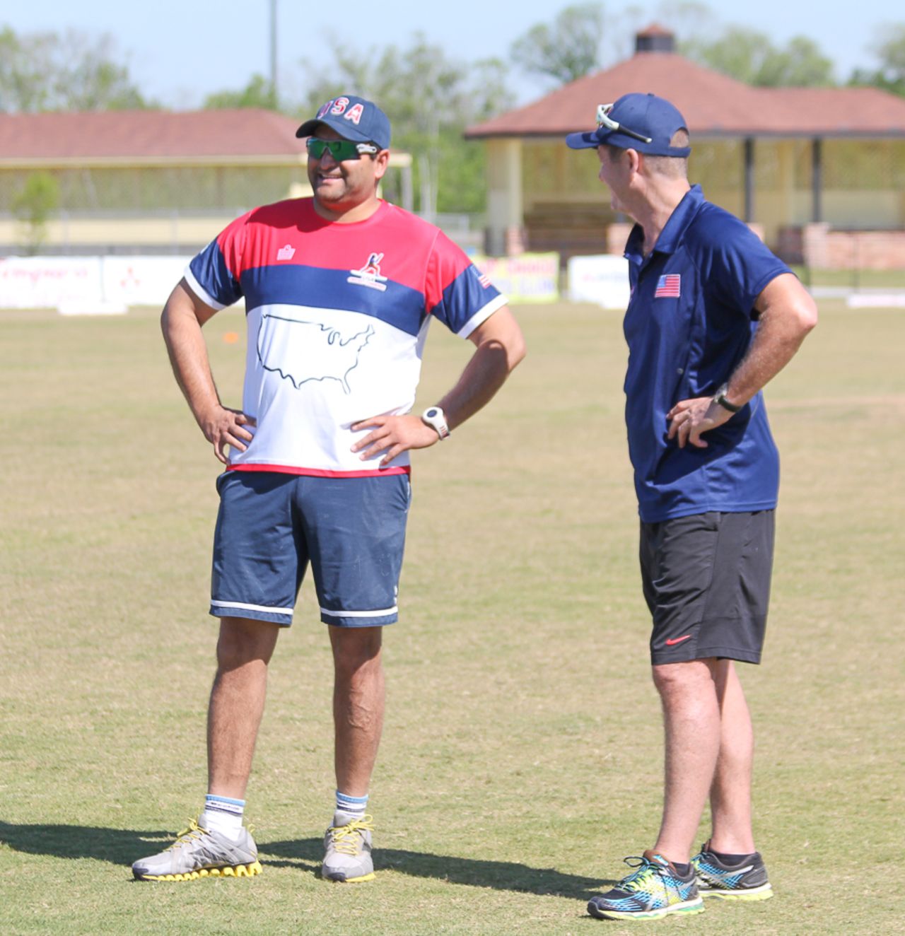 Former USA captain Sushil Nadkarni chats with fielding coach Trevor Penney, Pearland, April 7, 2017