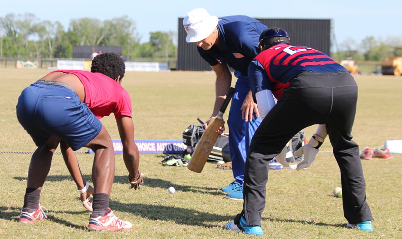 Wicketkeeping guru Peter Anderson puts USA keepers Akeem Dodson and Ibrahim Khaleel through a golf ball catching drill, Pearland, April 8, 2017
