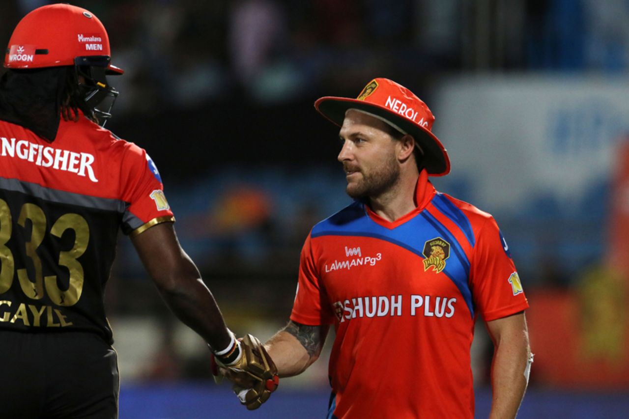 Chris Gayle and Brendon McCullum shake hands after the latter's floppy hat handed the Jamaican a reprieve, Royal Challengers Bangalore v Gujarat Lions, Rajkot, IPL 2017, April 18, 2017