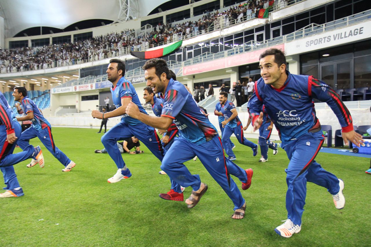 Fans rejoice as Afghanistan players sprint out after the winning runs, Afghanistan v Ireland, Desert T20, Final, Dubai, January 20, 2017