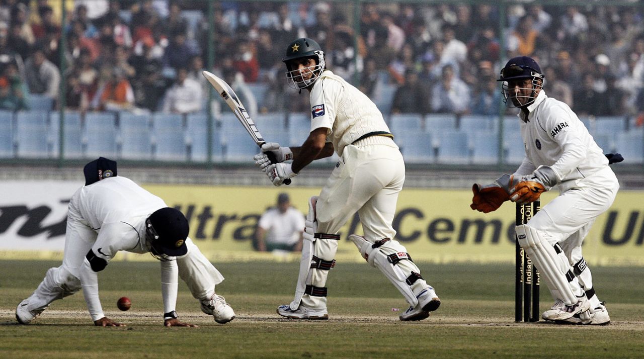 Dinesh Karthik tries to stop a ball at short leg from Misbah-ul-Haq, India v Pakistan, 1st Test, Delhi, 4th day, November 25, 2007