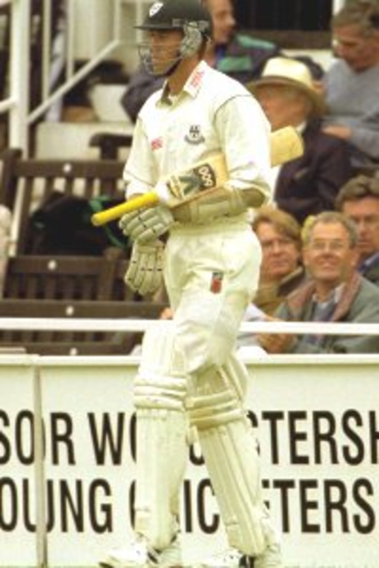 4 Jul 2000: Glenn McGrath of Worcestershire passes team-mate Matthew Rawnsley on his way to bat against Gloucestershire in the third round replay of the Natwest Trophy match at Worcester. Gloucestershire went on to win the game in the final over of the match by five runs.