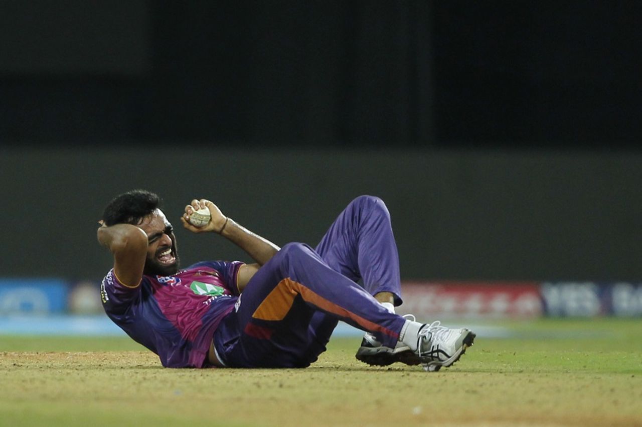 Jaydev Unadkat banged his head against the turf after taking a catch off his own bowling, Mumbai Indians v Rising Pune Supergiant, IPL 2017, Mumbai, April 24, 2017