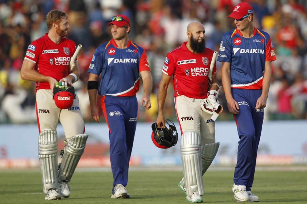 Martin Guptill and Hashim Amla have chats with their respective compatriots in the opposition at the end of the game, Kings XI Punjab v Delhi Daredevils, IPL 2017, Mohali, April 30