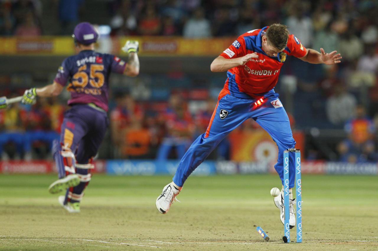 James Faulkner lets the ball hit the stumps during Rahul Tripathi's run out with a livid Ben Stokes in the background, Rising Pune Supergiant v Gujarat Lions, IPL 2017, Pune, May 1, 2017