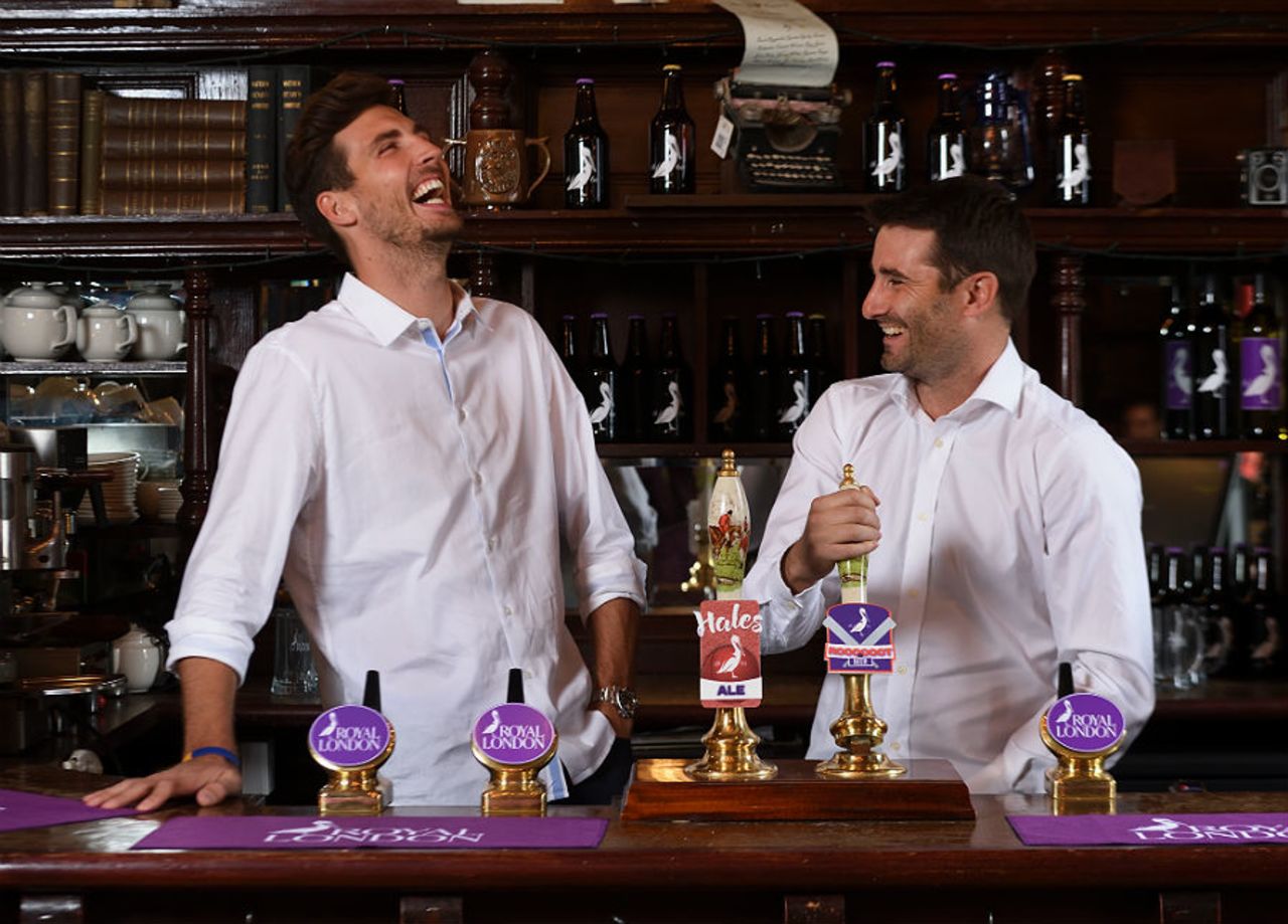 Steven Finn and Tim Murtagh pull pints during a Royal London promotional event, May 1, 2017