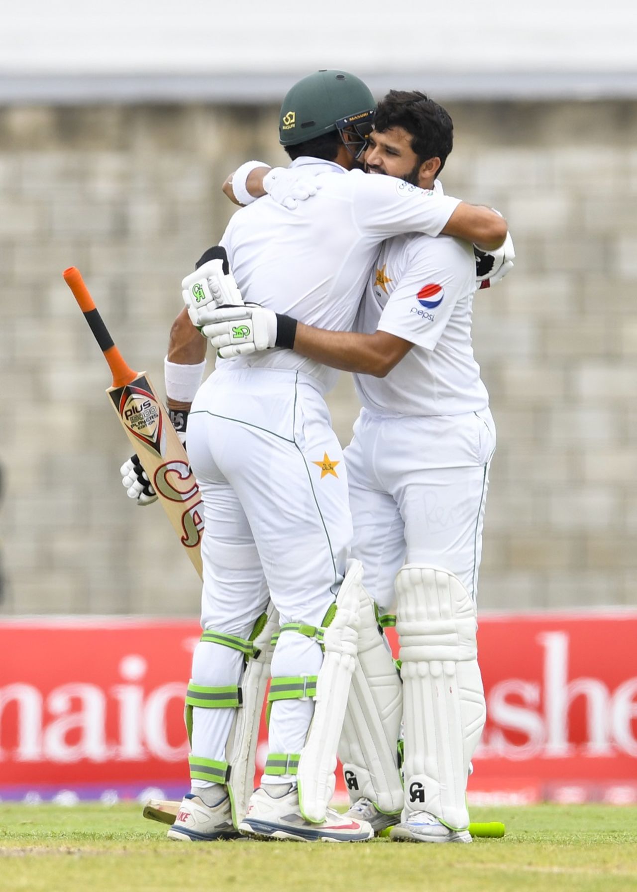 Azhar Ali celebrates his 13th Test century with his captain, West Indies v Pakistan, 2nd Test, Bridgetown, 3rd day, May 2, 2017