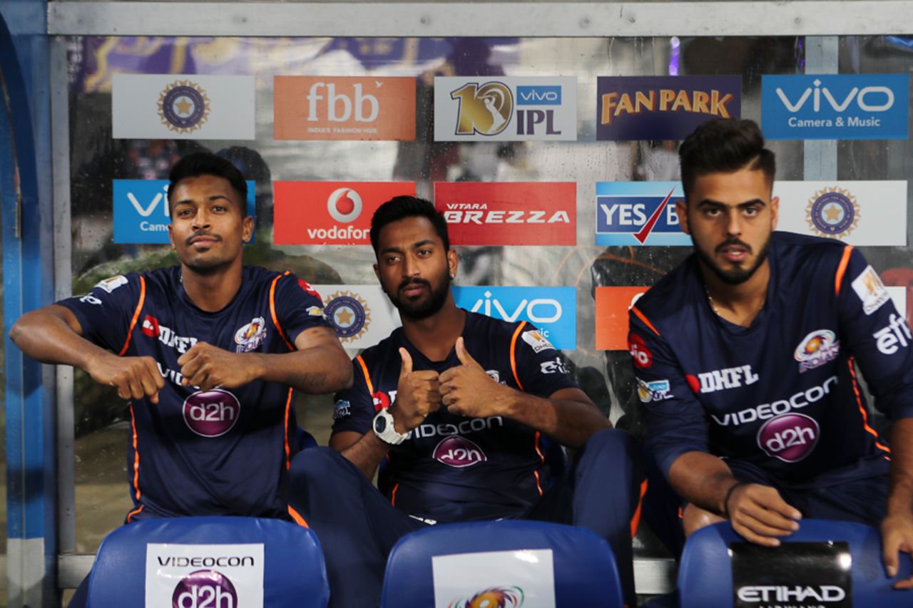 Hardik Pandya, Krunal Pandya and Nitish Rana wait in the dugout during the drizzle, Kolkata Knight Riders v Mumbai Indians, IPL 2017, Kolkata, May 13, 2017