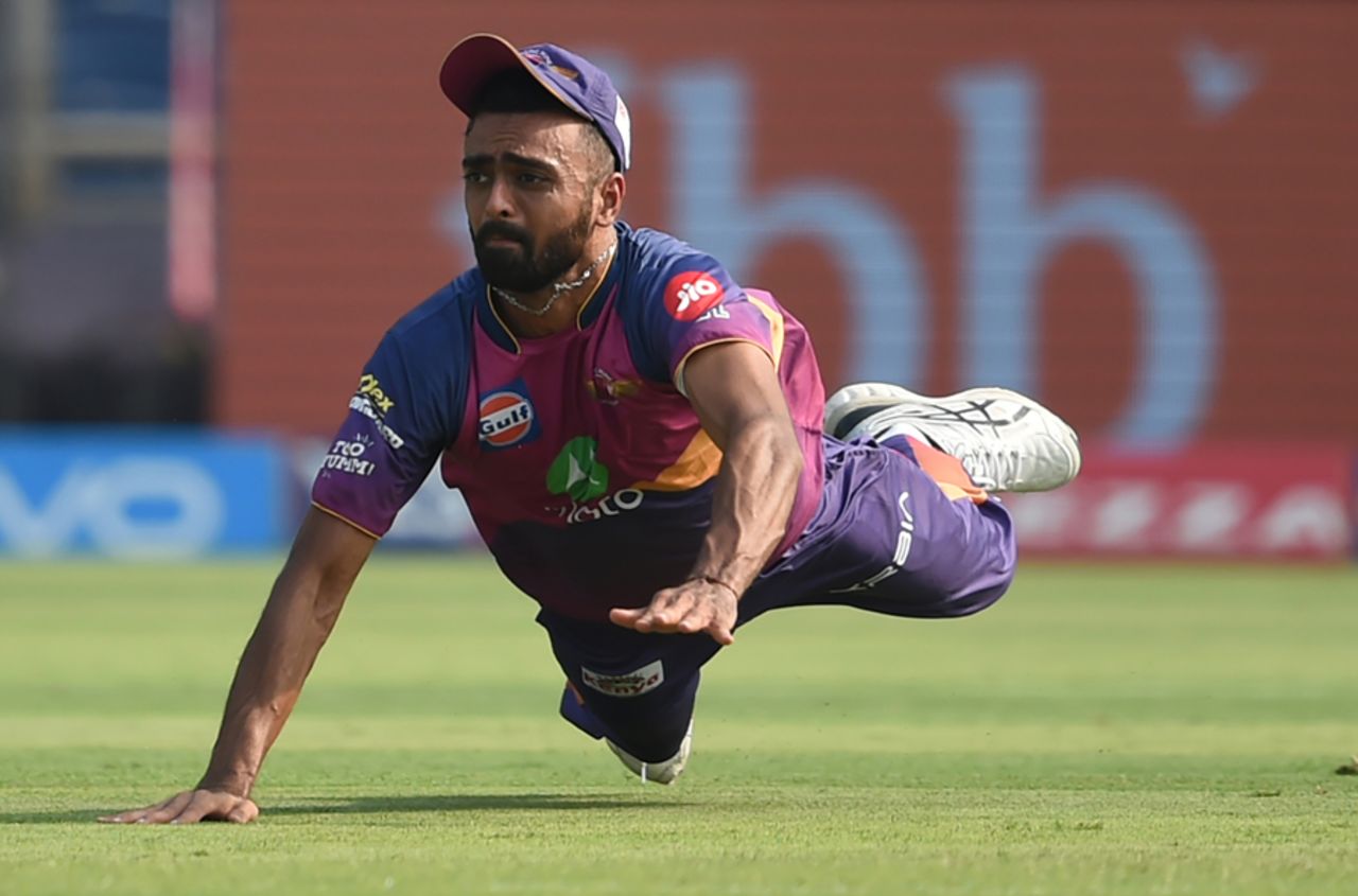 Jaydev Unadkat is airborne after throwing the ball to run Eoin Morgan out, Rising Pune Supergiant v Kings XI Punjab, IPL 2017, Pune, May 14, 2017
