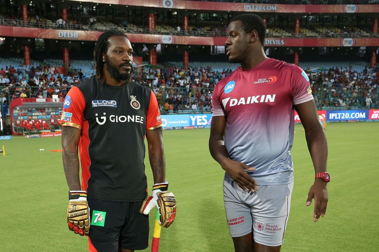 Chris Gayle catches up with his West Indies team-mate Carlos Brathwaite, Delhi Daredevils v Royal Challengers Bangalore, IPL 2017, Delhi, May 14, 2017