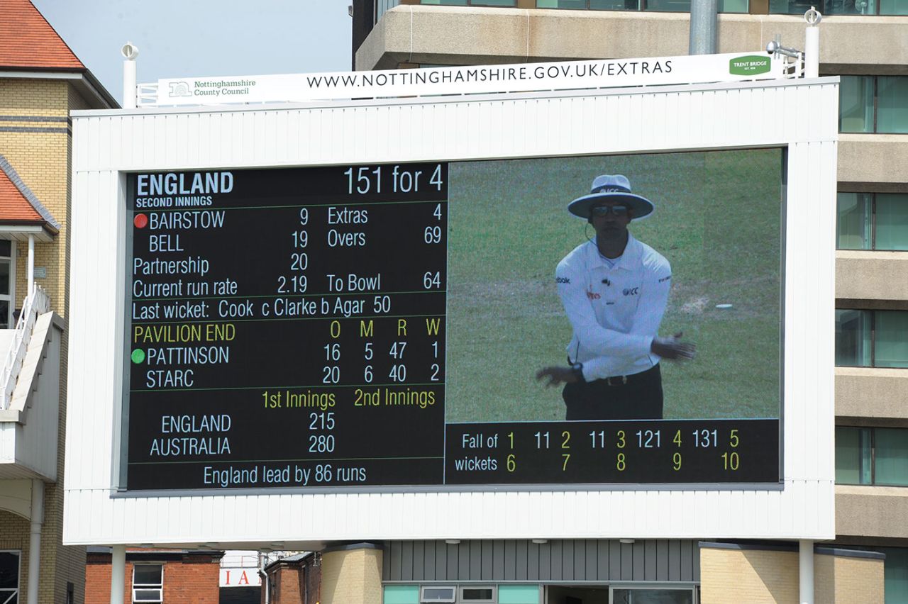 The scoreboard displays umpire Kumar Dharmasena signalling a decision being upheld after review, England v Australia, 1st Investec Test, Trent Bridge, day three, July 12, 2013