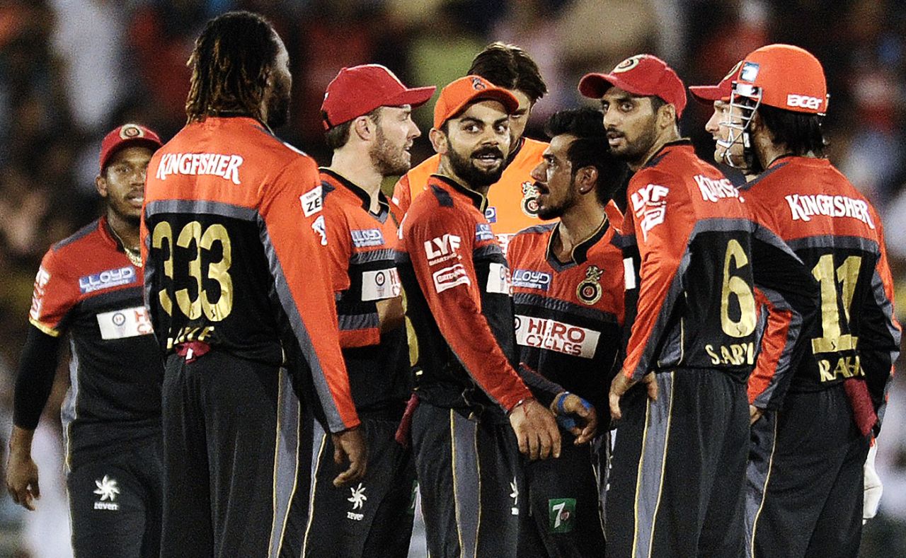 Chris Gayle, AB de Villiers, Virat Kohli and other Royal Challengers players celebrate a wicket, Delhi Daredevils v Royal Challengers Bangalore, IPL 2016, Raipur, May 22, 2016
