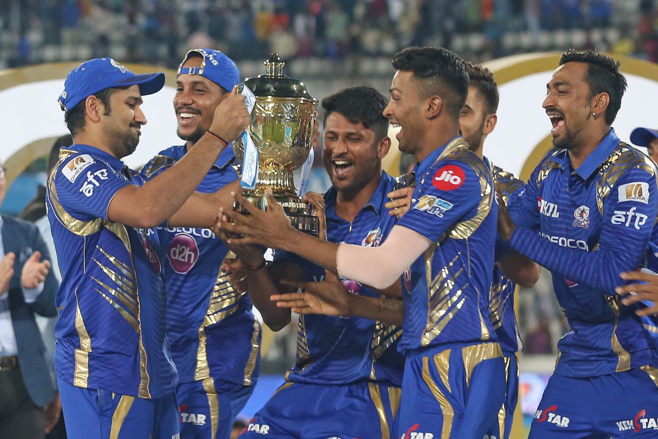 Rohit Sharma passes on the trophy to his delighted team-mates, Mumbai Indians v Rising Pune Supergiant, IPL final, Hyderabad, May 21, 2017